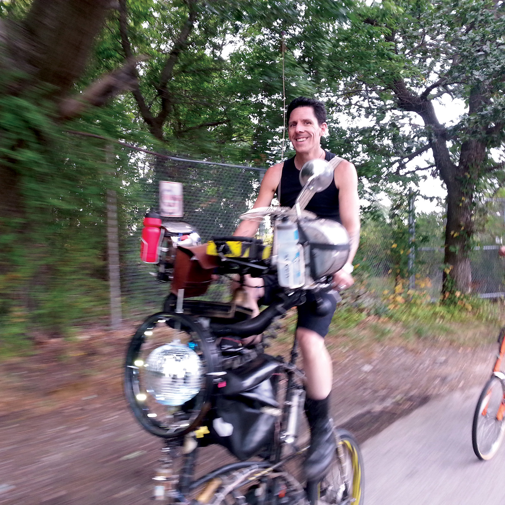 Skunk rides a tallbike named Cloudbuster